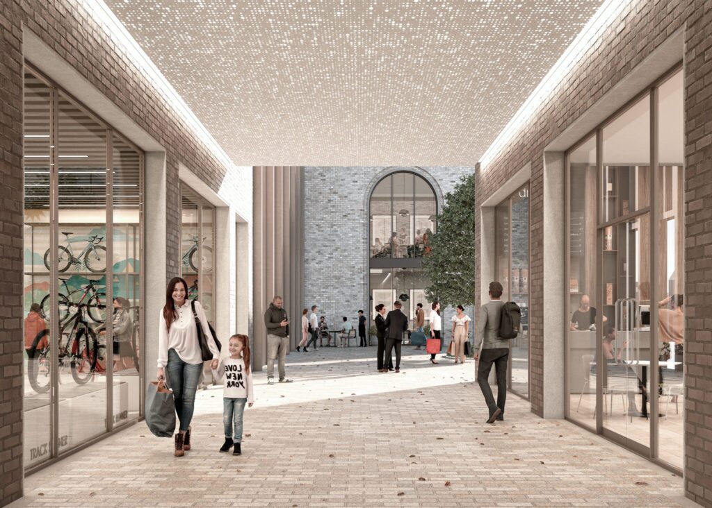 People walking past Origin Cambridge close to shops.